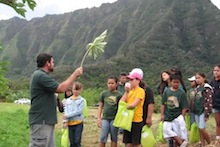 Ted Radovich with schoolchildren at the Waimanalo Research Station